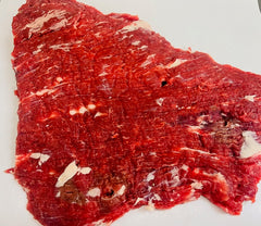 Raw beef steak on a white background