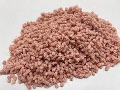 A pile of ground pork meat on white butcher paper