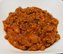 Red chili dish on a white plate
