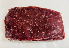 Block of raw meat on a white background
