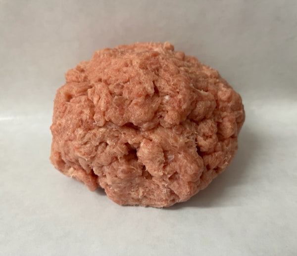 Ground turkey in a ball on a butcher paper background 