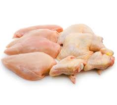 6 pieces  raw, cut-up chicken pieces. Skin on & skin off  on a white butcher paper.