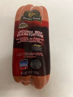 Packaged hot dogs with red and white labeling, indicating 'uncured bed frankfurters', 'no added nitrates', and 'gluten-free'. The brand 'Boar's Head' is prominently displayed.