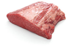 A raw beef brisket point off on white butcher paper