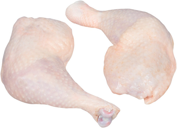 Two chicken thighs on a white background. 