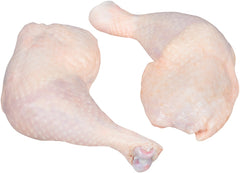 Two chicken thighs on a white background. 