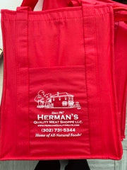 A red insulated grocery bag with the logo 'Herman's Quality Meats' printed on the front.