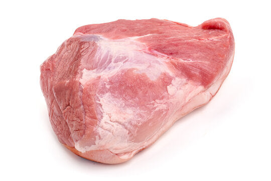 A piece of pork butt meat on a white background.