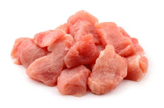 raw pork cubes on white butcher paper