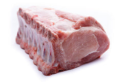 A loin-cut pork roast with a tied knot at the center, resting on a white background.