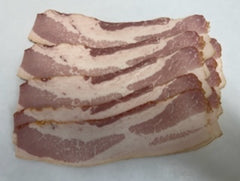 slab of raw bacon on white bacon