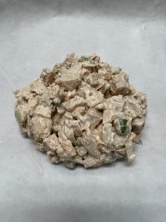 A prepared salad mix featuring smoked chicken, ready to be served.