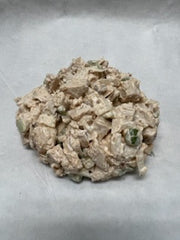 A prepared salad mix featuring smoked chicken, ready to be served.
