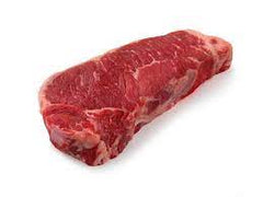 A single, boneless beef strip steak on a white background.