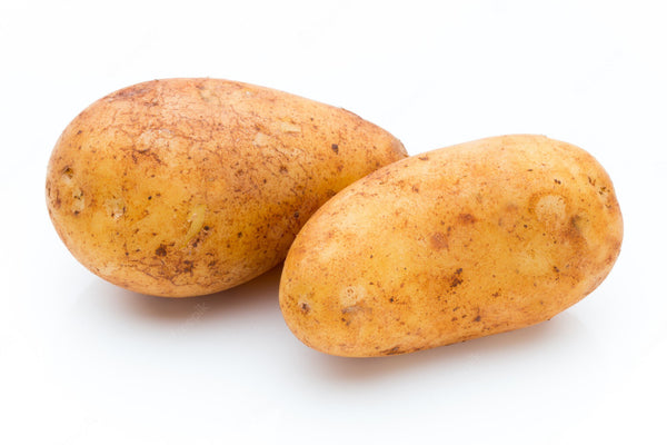 Two potatoes next to one another with a white background. 