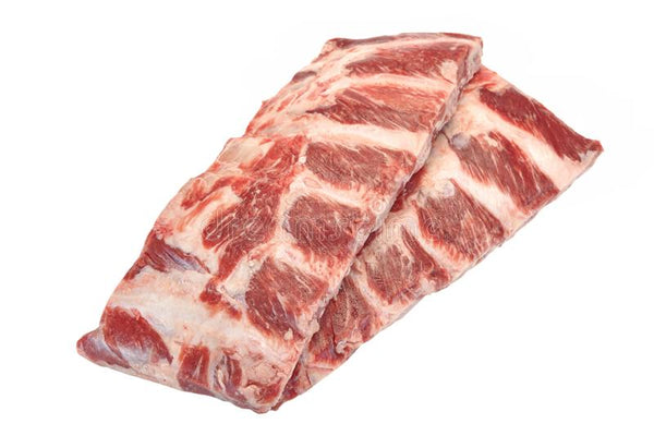 A stack of fresh beef barbecue ribs on white butcher paper