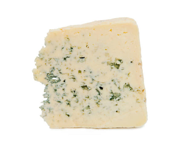 A wedge of blue cheese with a visible moldy blue surface area and a chunk broken out from the top.