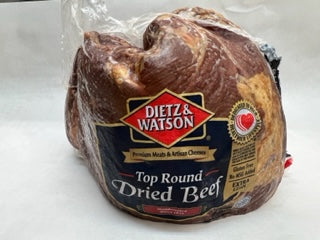 a package wrapped in plastic of Dietz & Watson Top Round Dried Beef  on white butcher paper