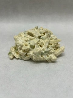 a pile of egg salad on white butcher paper