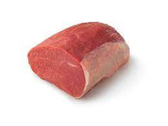 A raw eye of round roast beef on a white background.