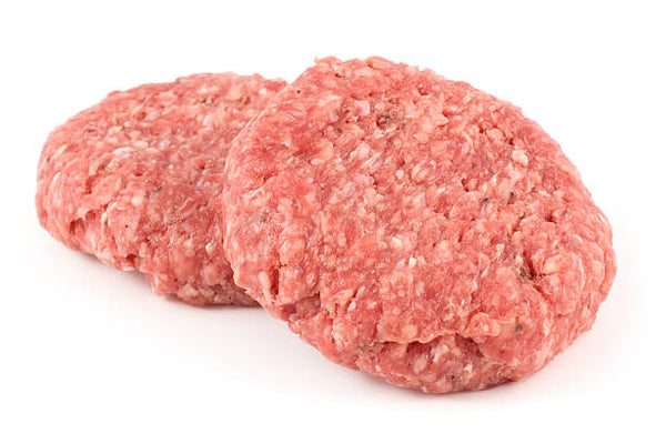 Two raw ground beef patties on a white background