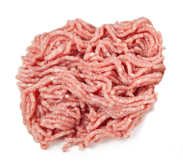 A group of fresh ground veal meat on a white background.