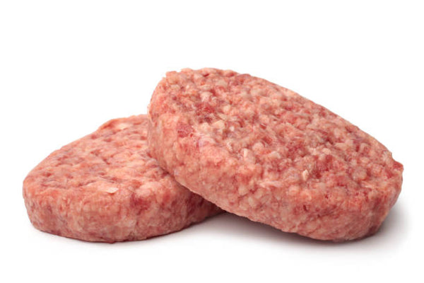 Two raw ground veal patties on a white background.