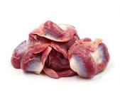 A pile of fresh, raw chicken giblets, livers, hearts, and necks on a white background.