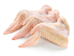 Three chicken wings laying together with a white background. 