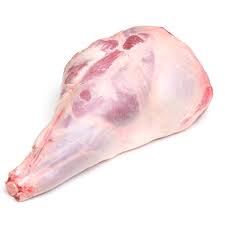 A whole, raw leg of lamb on a white butcher paper.