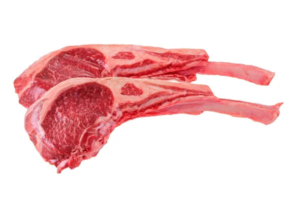 Raw lamb rib chops isolated on a white background