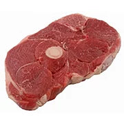 A raw lamb steak on a white background.