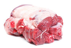 a raw lamb roast that is tied on white butcher paper