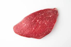 A single raw London Broil steak on a white background