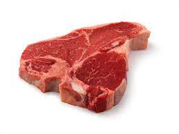 A single porterhouse steak on a white background.