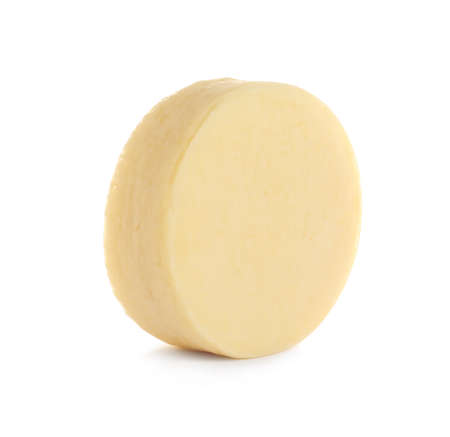A round piece of Provolone cheese on a white background.