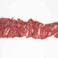 Skirt steak thinly cut on white background. 
