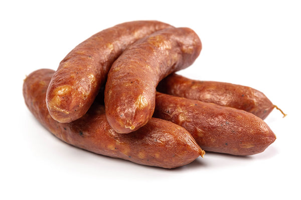 Five links of smoked Bratwurst on white butcher paper