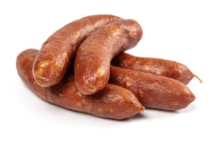 Five links of smoked Bratwurst on white butcher paper