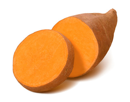 Sweet potato sliced and facing open on a white background. 