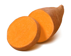 Sweet potato sliced and facing open on a white background. 