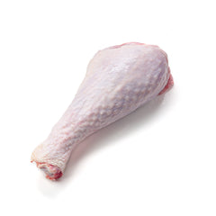 Raw turkey leg on a white background. 