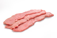 Raw veal cutlets, sliced in a parallel direction, on a white background.